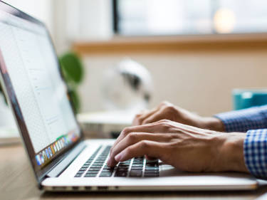 Photo of person using computer