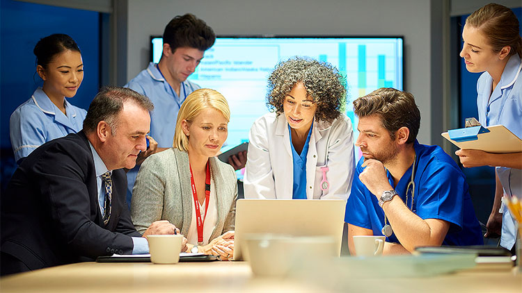 Medical and business professionals working together